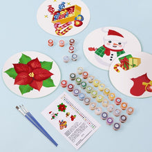Cargar imagen en el visor de la galería, Pintar por números Salvamenteles 20 cm (4 piezas) - Muñeco de Nieve, Flor de Pascua y Regalos