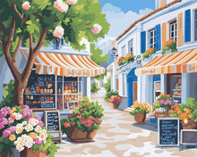 Cargar imagen en el visor de la galería, Pintar por numeros Figured'Art - Calle de flores soleada