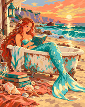 Cargar imagen en el visor de la galería, Pintar por numeros Figured'Art - Sirena leyendo junto al mar al atardecer