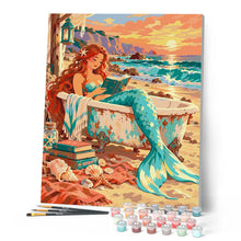 Cargar imagen en el visor de la galería, Sirena leyendo junto al mar al atardecer
