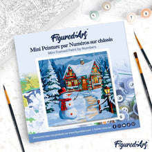 Cargar imagen en el visor de la galería, Mini Pintura por Números 20x20cm con bastidor Muñeco de Nieve y la Cabaña