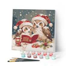 Cargar imagen en el visor de la galería, Mini Pintar por Números 20x20cm con bastidor - Búhos de Papá Noel leyendo