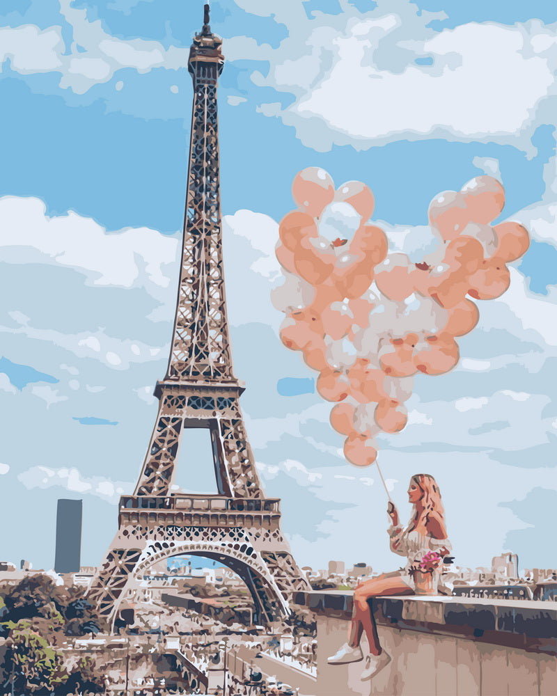 Mujer con globos junto a la Torre Eiffel