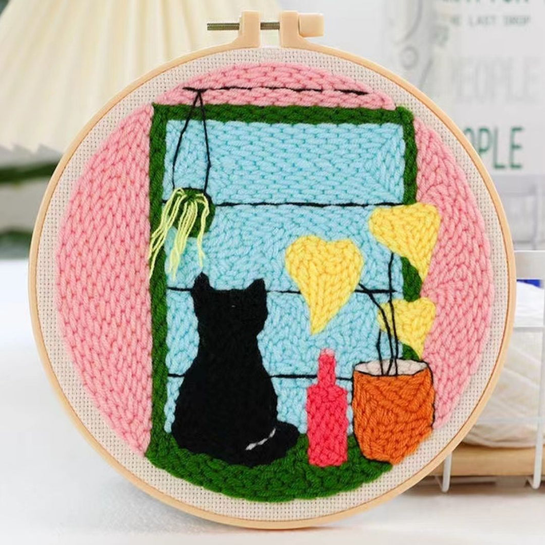 Punch Needle Gato junto a la ventana